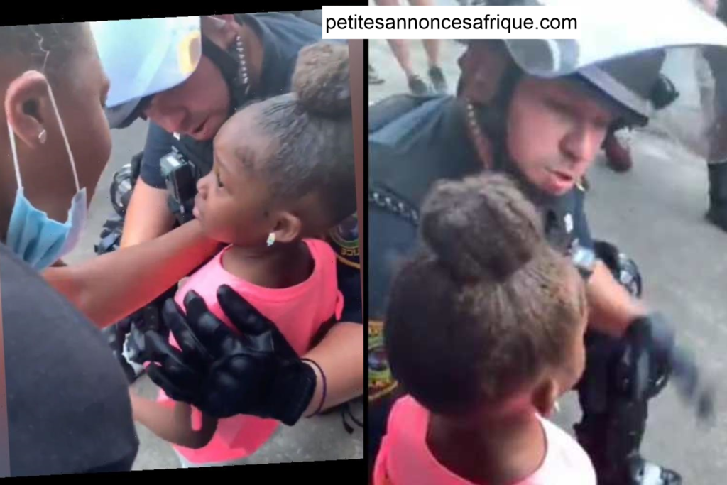 Une petite fille demande à un policier si elle va se faire tirer dessus